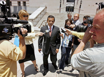 Reporters pepper Los Angeles Mayor Antonio Villaraigosa with questions on Tuesday about the new investigation into his use of free tickets to shows and sporting events.