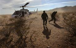 Border Patrol agents deplane Dec. 9 on Tohono O'odham Reservation in Arizona looking for drug smugglers