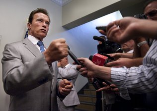 Gov. Arnold Schwarzenegger talks Tuesday about budgetmatters. A spokesman for the Department of Finance said California is counting on $1.8 billion in a U.S. Senate bill that would give states $24 billion for their Medicaid programs.