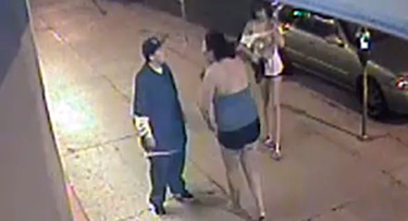 Surveillance video shows the victim being approached by the suspects.