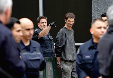 David Gardner, 50, of Reno is arrested by the LAPD on suspicion of trying to steal copper and other metals from the Garfield Building in downtown Los Angeles.