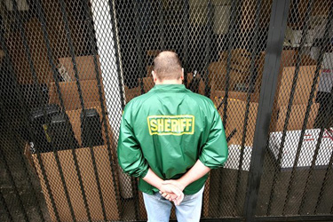 Los Angeles County Sheriff's deputies remove evidence and files from Maywood police headquarters. The sheriff's department has taken over policing for Maywood and many other cities across Los Angeles County.