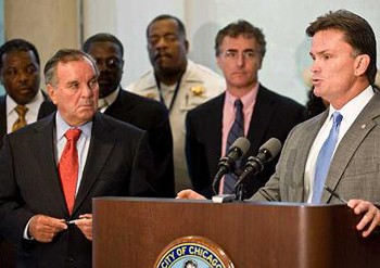 Mayor Daley listens as Chicago Police Supt. Jody Weis discusses the city's crime statistics. Daley, who was joined by Weiss and Cook County Sheriff Tom Dart, announced new initiatives to fight crime.