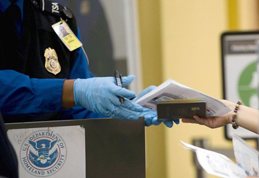 A Transportion Security Administration officer checks ID at Reagan National Airport outside Washington, D.C.