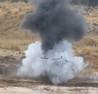 Photo of a homemade bomb, built by FBI explosives experts, explodes during a class, for police officers, fire fighters and first-responders