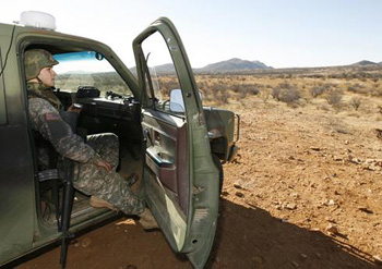 In this 2007 file photo, a National Guard unit patrols at the Arizona-Mexico border in Sasabe, Ariz.