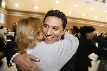 Councilman Jose Huizar greets supporter Lucy Ramos at Salesian High, his campaign headquarters. Huizar had fought an acrimonious race with onetime friend Rudy Martinez.