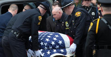 Officers gathered Jan. 14 for the services of slain Rainier Police Chief Ralph Painter in Portland, Ore.