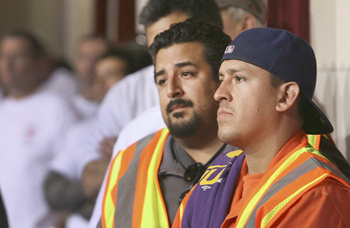 Max Marrufo, left, and Henry Barrons join city workers at Wednesday's meeting in urging the council not to approve more furloughs.