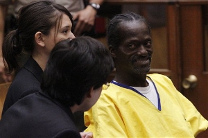 Stanford law school students Gabriel Martinez and Reiko Rogozen listen with Gregory Taylor during a hearing in Los Angeles Superior Court Monday, Aug. 16, 2010. A judge on Monday ordered the release of Taylor, a man serving a potential life sentence for stealing food from a Los Angeles church.