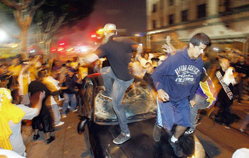 A mob destroys a car parked near Staples Center after the Lakers' won the NBA Finals in 2009. LAPD officials say they'll be ready with plenty of officers, strategically placed, to prevent any such activity if the Lakers win the 2010 championship.