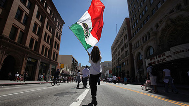 Milagros Vizcaino, 13, of Los Angeles heads home after participating in the May Day march protesting Arizona's harsh new immigration law.