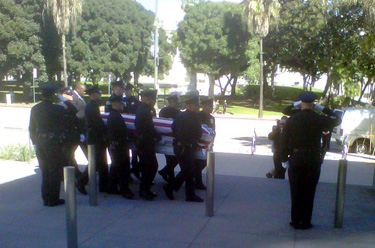 Los Angeles Police officers carry the coffin of police officer and U.S. Marine Corps reservist Joshua Cullins, who died two weeks ago while serving in Afghanistan.