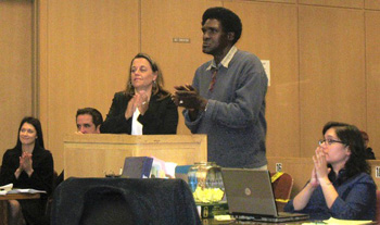 Deputy Public Defender Jennifer Johnson and Milton Conley stand at the podium in Judge Garrett Wong's courtroom, where Conley was applauded for following his treatment plan and believing in himself.