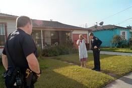 Oakland police officers Curtis Filbert and John Hargraves spoke to a resident in East Oakland this week after being called to a home break-in.