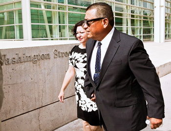 Police officer David Salgado arrives at the courthouse in Phoenix. His legal challenge to Arizona's controversial immigration law drew both critics and supporters to the federal hearing.