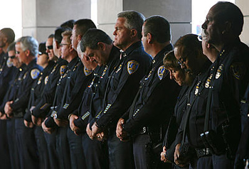 Riverside police officers line up last week before the start of fellow Officer Ryan Bonaminio's memorial service at the Grove Community Church in Riverside.