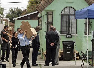 Items are removed from the South Los Angeles home of Lonnie David Franklin, Jr. Franklin was arrested on 10 counts of murder and one attempted murder. Police allege that he is the Grim Sleeper serial killer.