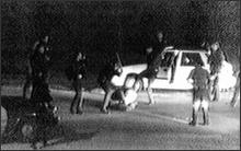 FILE - This March 3, 1991 file video tape shot by George Holliday shows what appears to be a group of police officers beating Rodney King with nightsticks and kicking him as other officers look on. Thursday, March 3, 2011, marks the 20th Anniversary of the video taped beating. Los Angeles Police Chief Charlie Beck says his department has gone through sweeping reforms since the 1991 Rodney King beating, and he doesn't think his officers would engage in such a videotaped assault today.