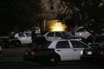 Police cars surround the apartment complex on South Meadowbrook Drive at Paradise Valley Road following the shooting.