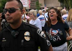 Tea Party activist Allison Culver shouts at opponents during a demonstration against illegal immigration this weekend in Phoenix.