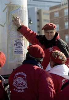 Guardian Angels founder Curtis Sliwa speaks to his people before sending them out into Camden, N.J., Sunday, Jan. 16, 2011. The Guardian Angels began patrolling in Camden, where about half of the police force is expected to be laid off Tuesday.