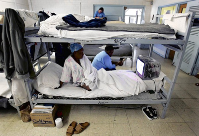 Inmates watch TV at the California Institution for Women in Chino, where inmate overcrowding has led to day rooms being converted to house prisoners. (Los Angeles Times / September 13, 2011)