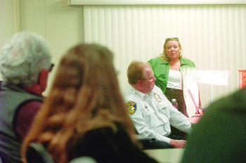 Vallejo police dispatch supervisor Kelly Newman, right, talks at Wednesday's forum about the challenges and the nature of the dispatcher's job in a pared-down Vallejo Police Department, with a large volume of reports requiring that priorities be set for officers' responses.