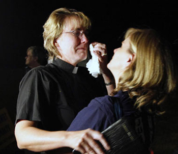 The Rev. Lynn Litchfield, left, hugs a friend outside Greensville Correctional Center in Jarratt, Va., after the execution of Teresa Lewis on Thursday.